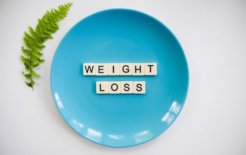 Weight loss tiles on a plate, symbolizing the benefits of intermittent fasting
